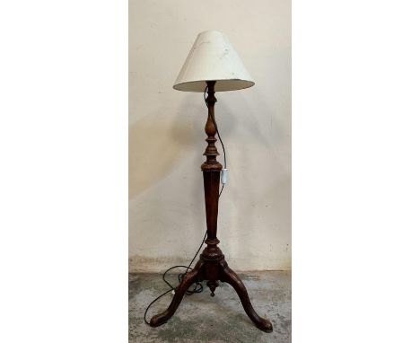 A carved mahogany floor standing lamp on splayed feet (H103cm)