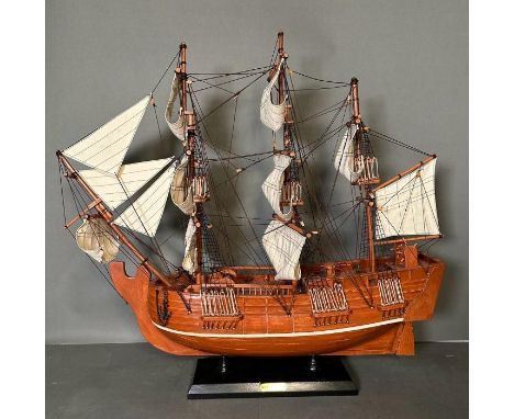 A large wooden scale model of HMS Pinafore on plinth 