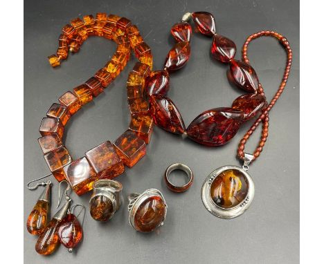 A large selection of quality Baltic amber jewellery to include three necklaces and three silver monuted rings.