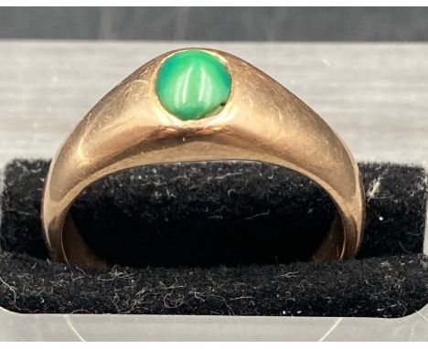 A gold and jade ring, size O, approximate total weight 6.9g
