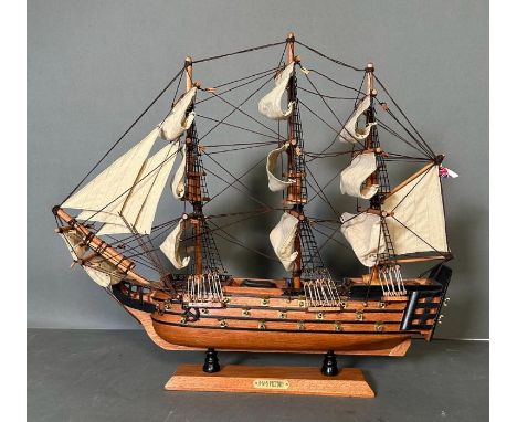 A wooden scale model of HMS Victory on plinth 