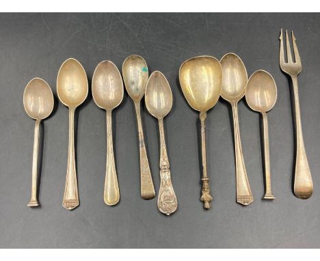 A selection of silver spoons and a fork 