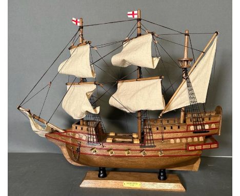 A wooden scale model of The Golden Hind on plinth 