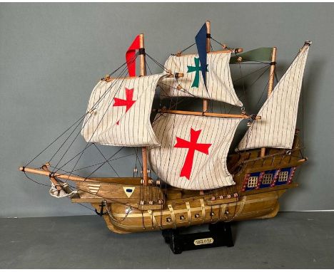 A wooden scale model of the Spanish Galleon Santa Maria on plinth 