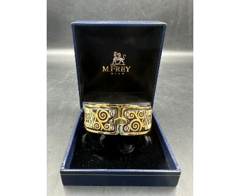 Michaela Frey, Wien. A Viennese enamel bangle with gilt metal mount