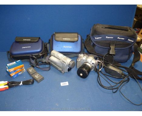 A Samsung Digital Cam PAL DVI digital video camera and accessories together with a Canon Powershot S2 IS camera, cased.