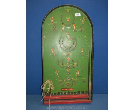 A 1940/50's pin football Bagatelle board with unusual silhouette images of spectators to the base.