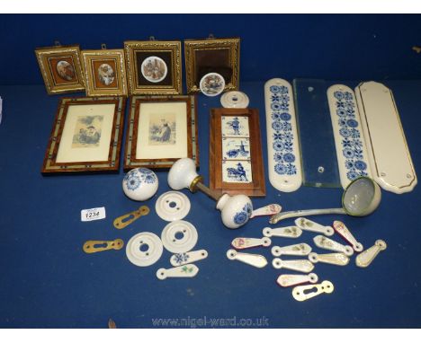 A box of door fitments including finger plates, door knobs and key hole covers and * tile pictures.