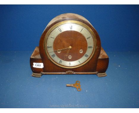 A Smiths domed Walnut type finished cased three train movement Mantel Clock, having Roman numerals and Westminster chimes, (k