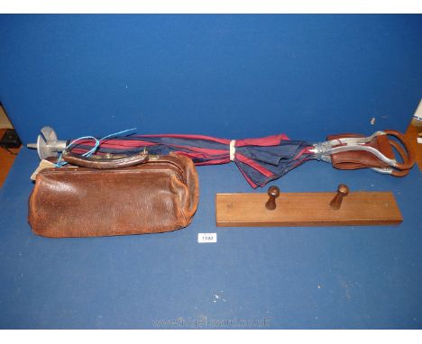A leather Gladstone bag, coat hook and a shooting stick/umbrella.