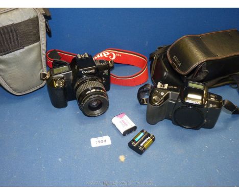 A small quantity of cameras including Canon E0S 1000 FN SLR camera with a Canon Zoom lens EF 35 -80 mm 4-5.6 2, in case, a Pe