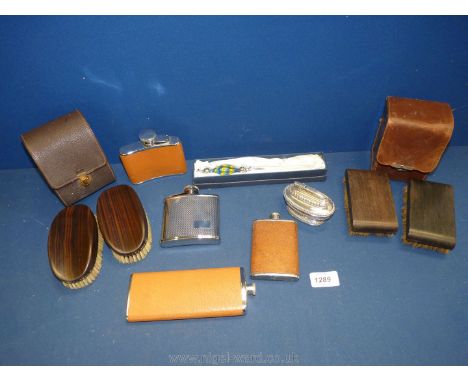 A quantity of hip flasks, shoe shine kits, table lighter, letter opener, etc.