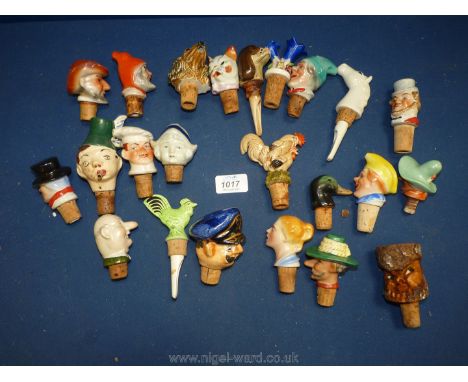 A quantity of ceramic and wooden novelty bottle stoppers.