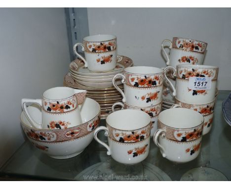 A part Heathcote china 'Ostend' pattern tea service to include; nine cups and tea plates, eight saucers, two bread &amp; butt