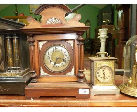 A Mahogany/Walnut mantle Clock with Arabic numerals and a brass finished carriage Clock