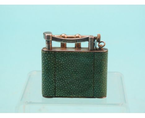 A Dunhill novelty cigarette lighter, incorporating powder compact and lipstick, shagreen and silver plate, patent 14444/28 