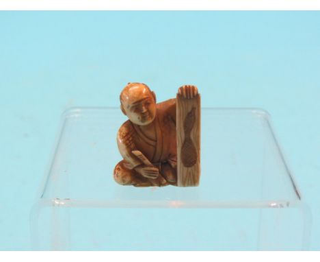 An ivory netsuke, artist seated with gourd painting and brush, signed, 1.5in. high  Shipping arrangements limited.  Buyer bew