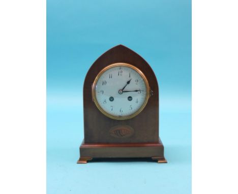 An Edwardian inlaid mahogany mantel clock, lancet-shape with convex enamelled dial, Arabic numerals, Mougin movement striking