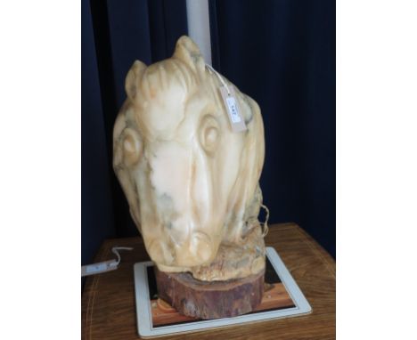 A large sculpted alabaster horse-head, formerly in use as an electrical table lamp, on wood plinth, 17in. high