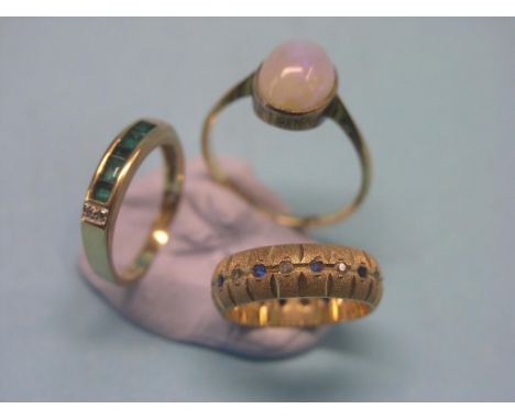 Three 9ct. gold rings, including large opal
