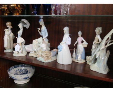 Three Lladro figures, including girl with umbrella, 10.5in., two Nao figures and four other Spanish porcelain figures