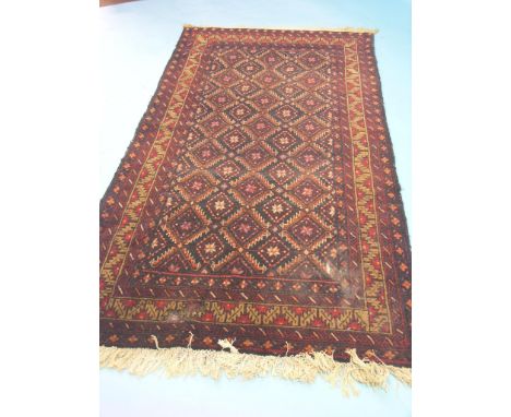 An Eastern wool rug, geometric designs predominantly in red, black and cream, 6ft. x 3ft. 3in. - worn patch, and a wool runne