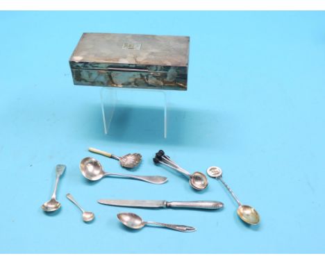 An engine-turned silver cigarette box, London 1954, containing an assortment of small silver flatware