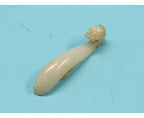 A Chinese celadon jade rui sceptre, with dragon-neck, 3.25in.