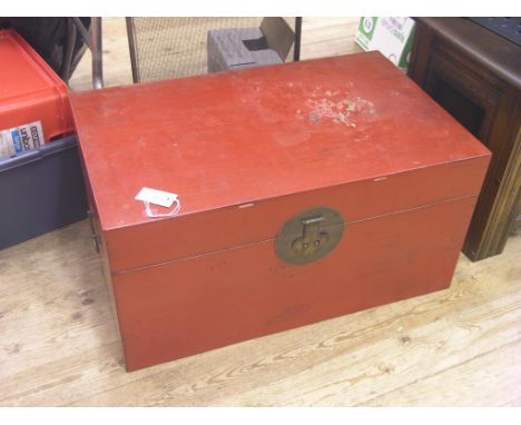 A Chinese cinnebar-lacquered trunk, with ornamental brass lock-plate and padlock, 2ft. 6in.