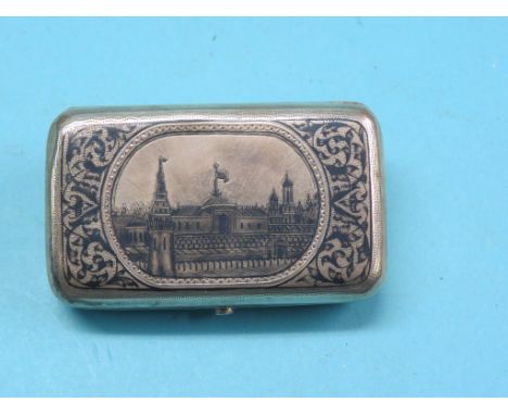A 19th century Russian 84 zlotnik and niello cigarette case, hinged cover engraved with a view of The Kremlin, Moscow against