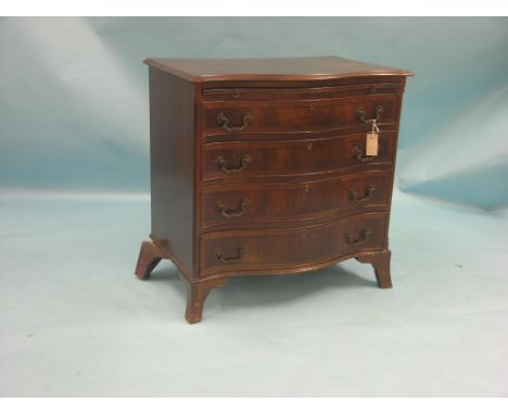 A Georgian-style mahogany chest, serpentine-fronted with four drawers and brushing slide, splay bracket feet, 2ft. 6in. - one