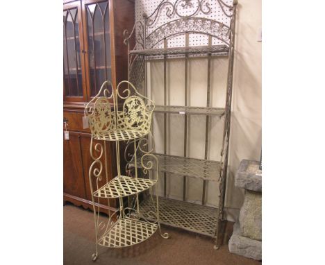 Two painted wrought metal shelf units, four-shelf unit with floral cresting, 2ft. 3in., and corner-fitting three-shelf unit 