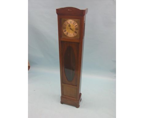 A mahogany longcase clock, traditional square brass dial and Black Forest chiming movement, with pendulum and brass-cased wei