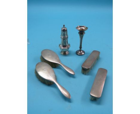 A silver sugar caster, London 1971, approx. 5.oz., together with an engine-turned silver four-piece brush set, Birmingham 192