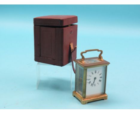 An early 20th century French brass carriage clock, enamelled dial and timepiece movement, with integral key, 5.5in., in origi
