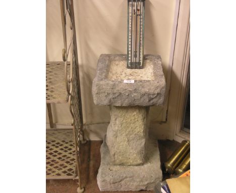 A moulded concrete bird-bath, in three sections, 1ft. 10in. high, and a Negretti & Zambra outdoor rise-and-fall thermometer, 