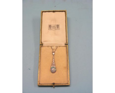 An Art Deco Liberty's diamond and black opal pendant, small old-cut diamonds, white metal mount and chain, in original leathe