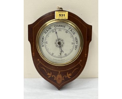 An Edward VII mahogany and inlaid aneroid barometer with silvered dial. 9¾' high