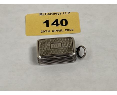 A Victorian silver engine turned vinaigrette with foliate pierced gilt grill. Birmingham 1839. 1' wide