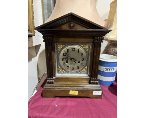 A mahogany mantle clock, the two train movement striking on a coiled gong. 14¼' high