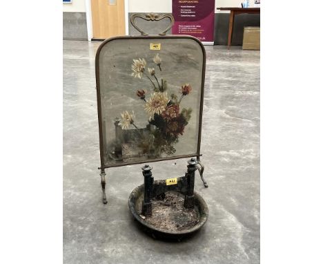 A cast iron boot scraper and a brass mirror firescreen