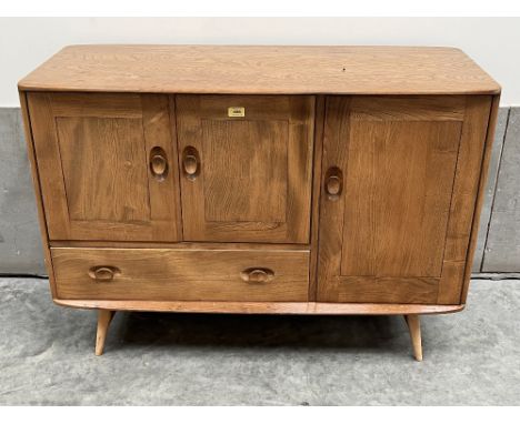 An Ercol light elm Windsor design sideboard. Model 467. c. 1962-1970. 45'w x 32'h