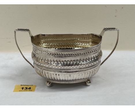 A George III silver sucrier with two beaded handles on ball feet. Crested. London 1807. 7¼' wide over handles. 7ozs 4dwts
