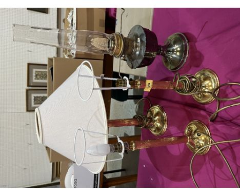 Three gilt metal table lamps and an oil lamp