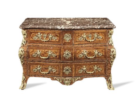 A Regence ormolu mounted kingwood, bois satine and amaranth bombe serpentine commode1725-1730The moulded marble top above two