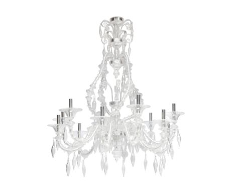 A Venetian twelve light blown clear glass chandelier ensuite to the previous lotthe reeded flared collars with plated tubular