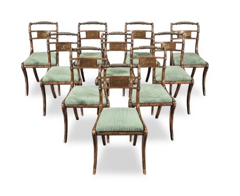 A set of ten Regency simulated rosewood and brass inlaid dining chairsCirca 1810, each with a spiral reeded and ring turned b