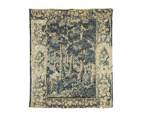 An 18th century vedure tapestry panelthe luscious landscape with a small pond scene to the lower left, a hare to the middle g