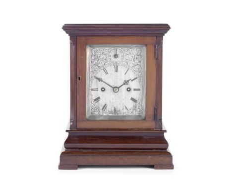 A late 19th century mahogany four glass mantle clockthe rectangular case with chamfered corners, below a moulded cornice, on 