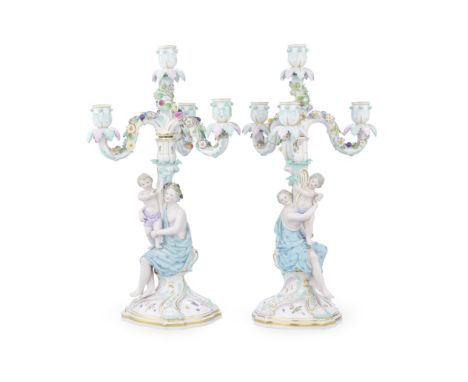 A pair of late 19th century Meissen porcelain four-light figural candelabrathe detachable candlestick bases formed as seated 